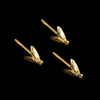 Set of three gold blue bottle fly hair slides against a black background.
